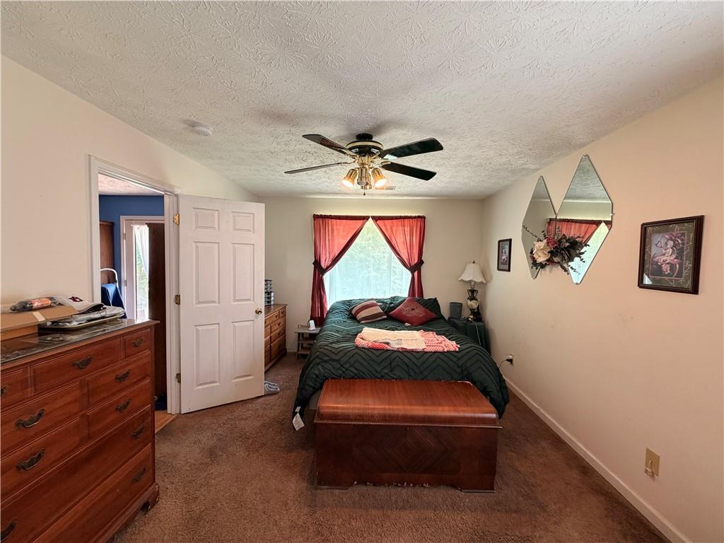 145 Stoneview Circle Covington, GA 30016 - Photo 38 of 41 a bed room with furniture and a window