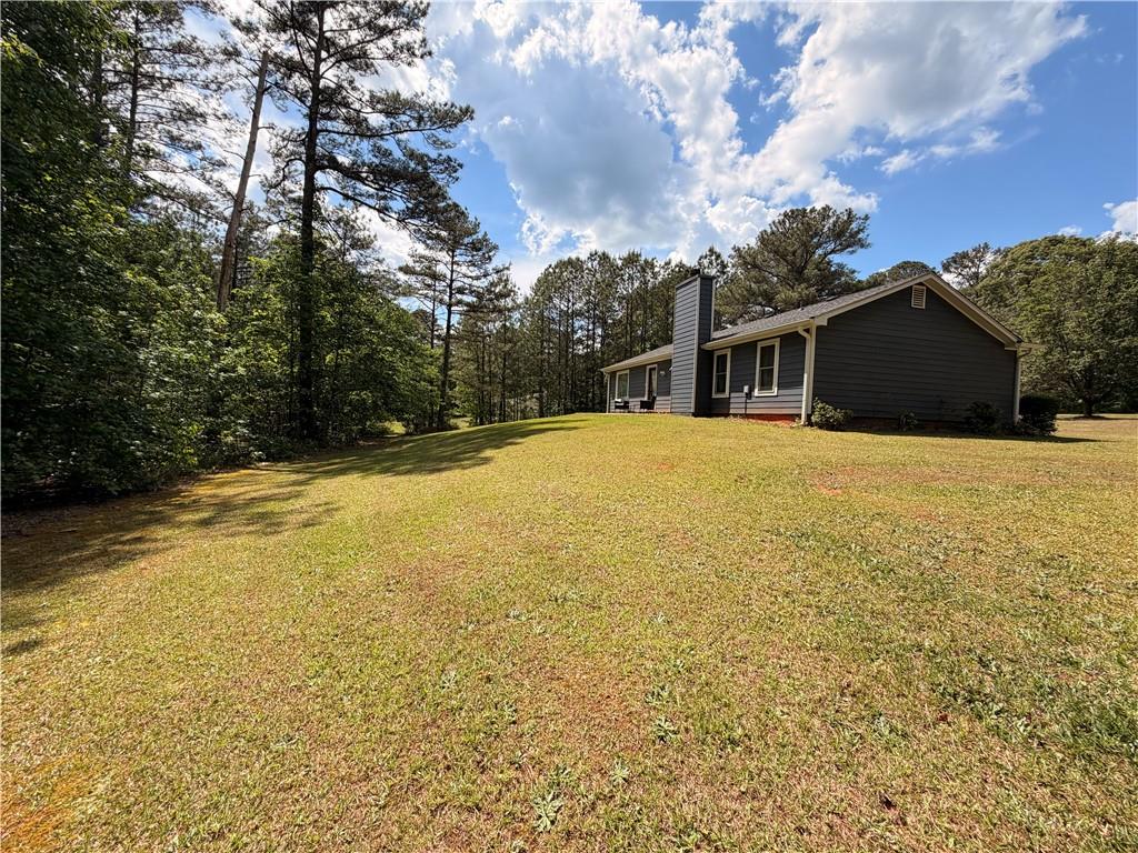 145 Stoneview Circle Covington, GA 30016 - Photo 7 of 41 a view of a yard with a house