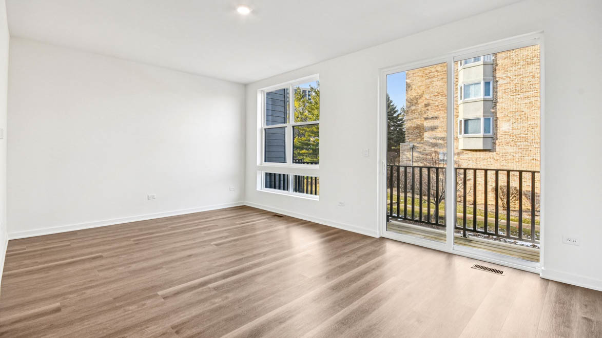392 Summit Circle Lombard, IL 60148 - Photo 39 of 61 a view of a room with wooden floor and windows