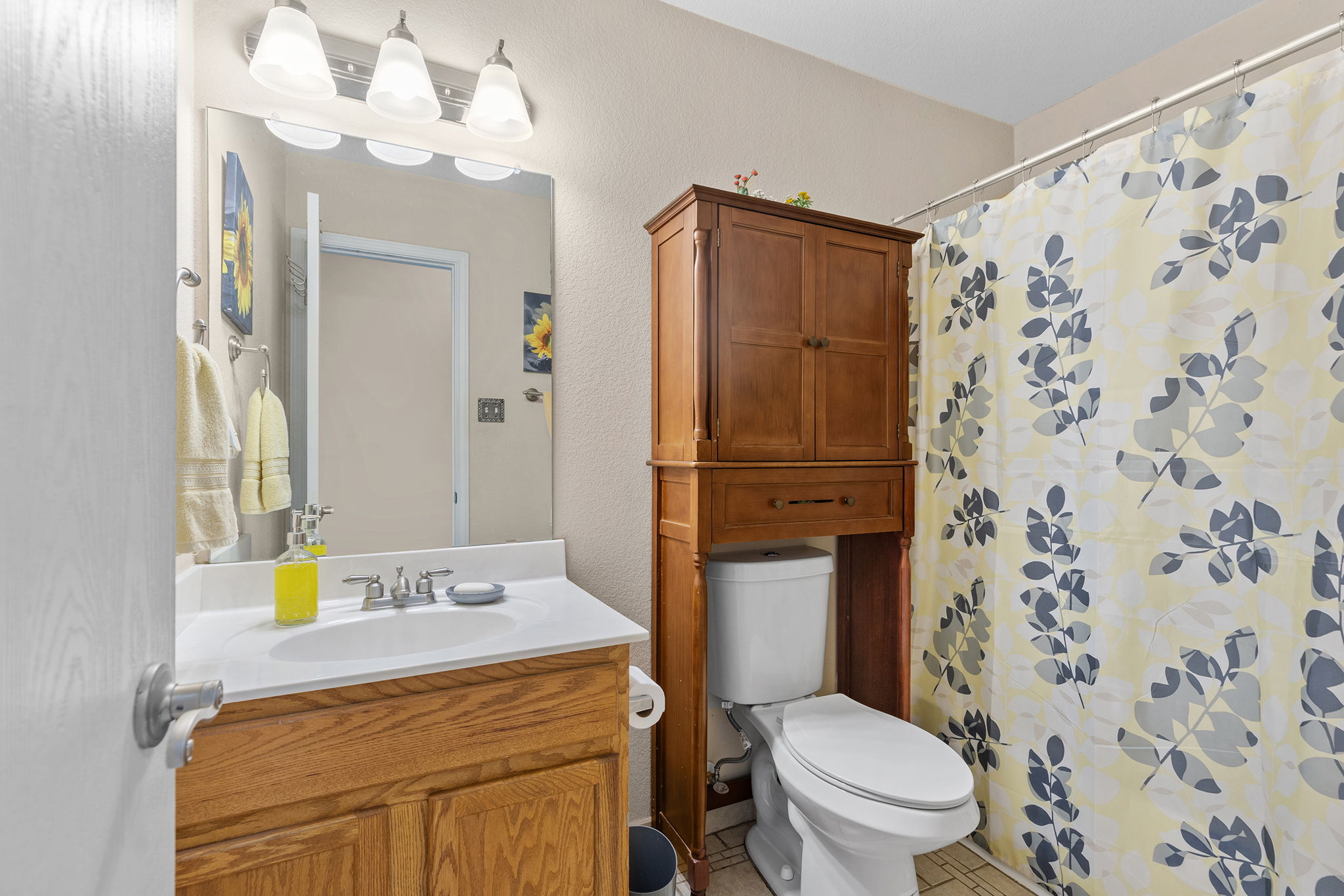 12800 Starbrimson Trail Elgin, TX 78621 - Photo 12 of 19 a bathroom with a sink toilet and shower