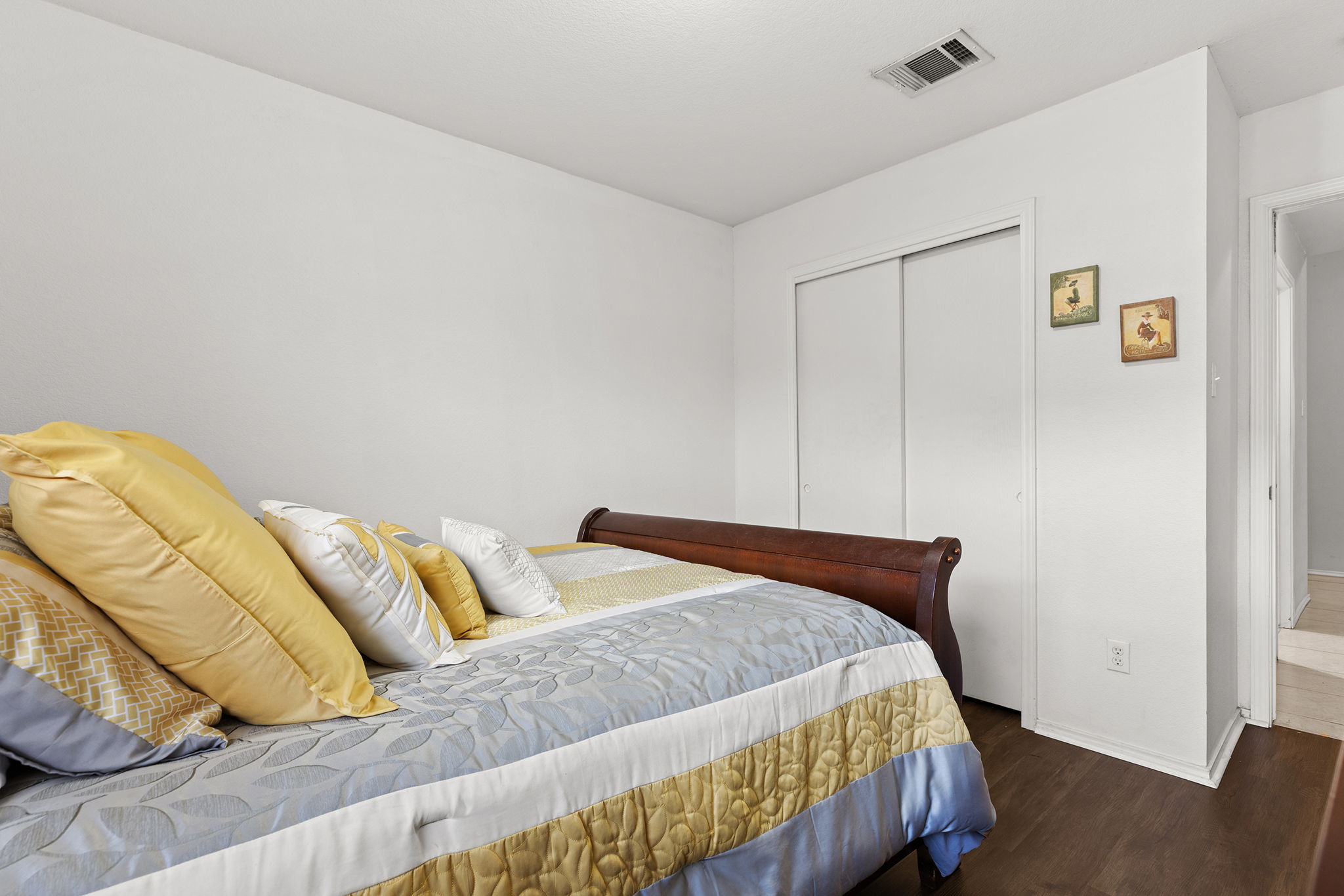 12800 Starbrimson Trail Elgin, TX 78621 - Photo 9 of 19 a bedroom with a bed and with wooden floor