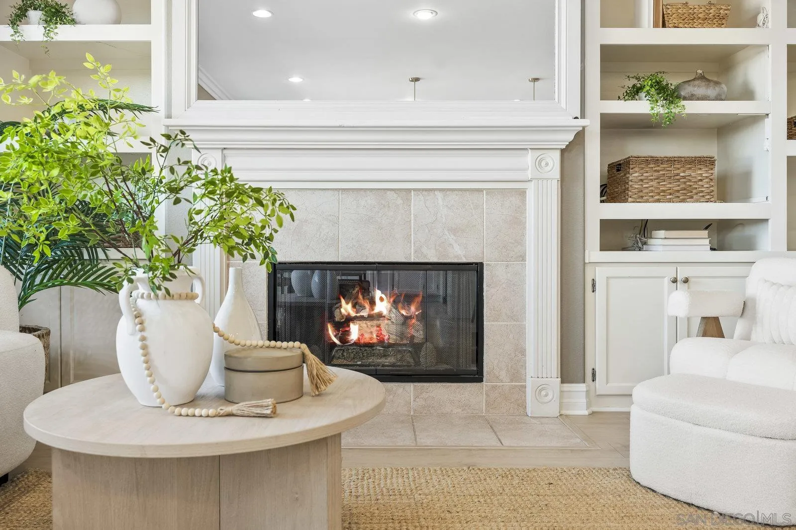 11542 Village Ridge Road San Diego, CA 92131 - Photo 11 of 42 a living room with furniture and a fireplace
