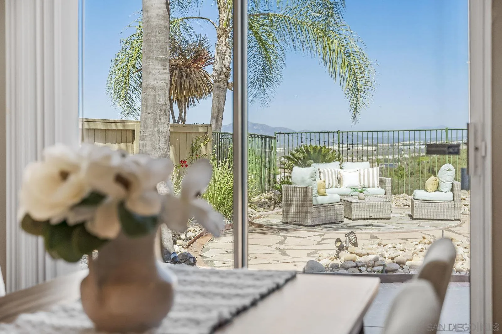 11542 Village Ridge Road San Diego, CA 92131 - Photo 13 of 42 a view of a vase of flowers sitting on a table