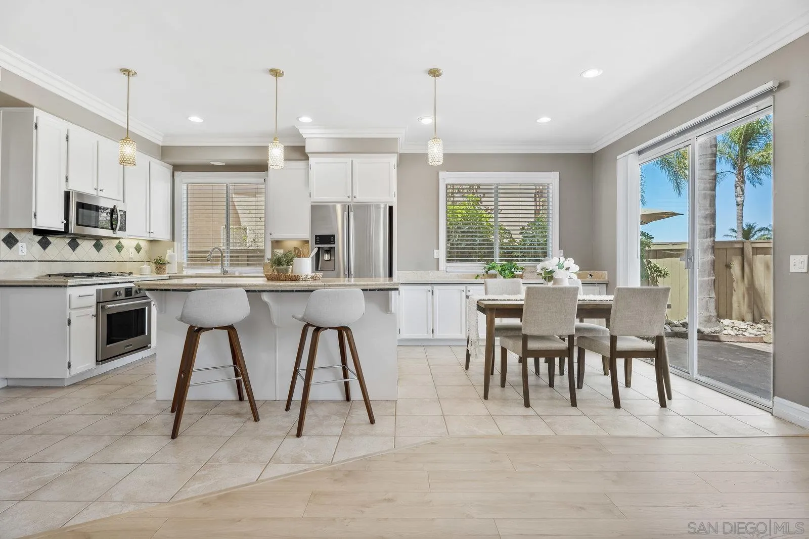 11542 Village Ridge Road San Diego, CA 92131 - Photo 14 of 42 a large kitchen with a table and chairs