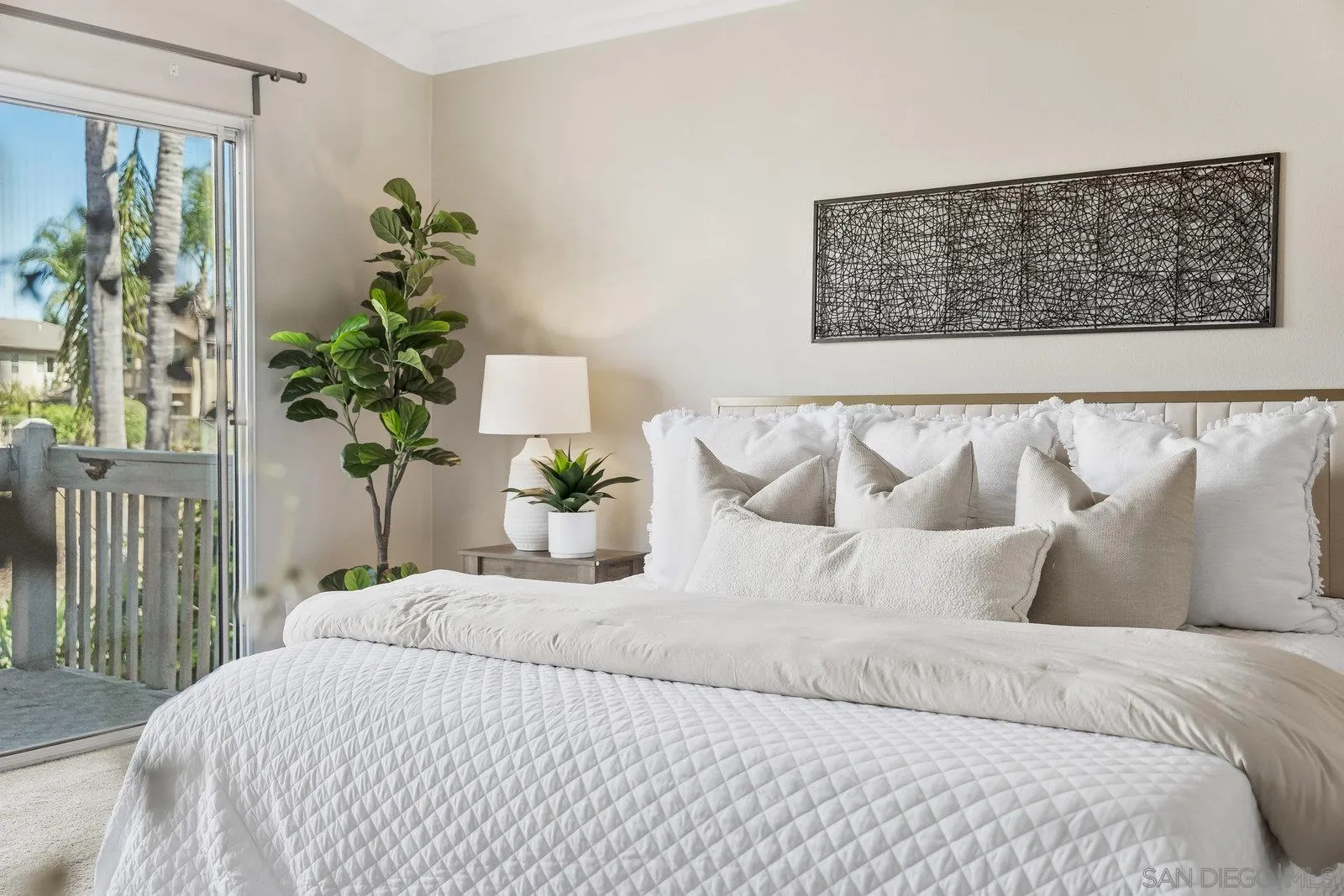 11542 Village Ridge Road San Diego, CA 92131 - Photo 19 of 42 a bedroom with a bed and a potted plant