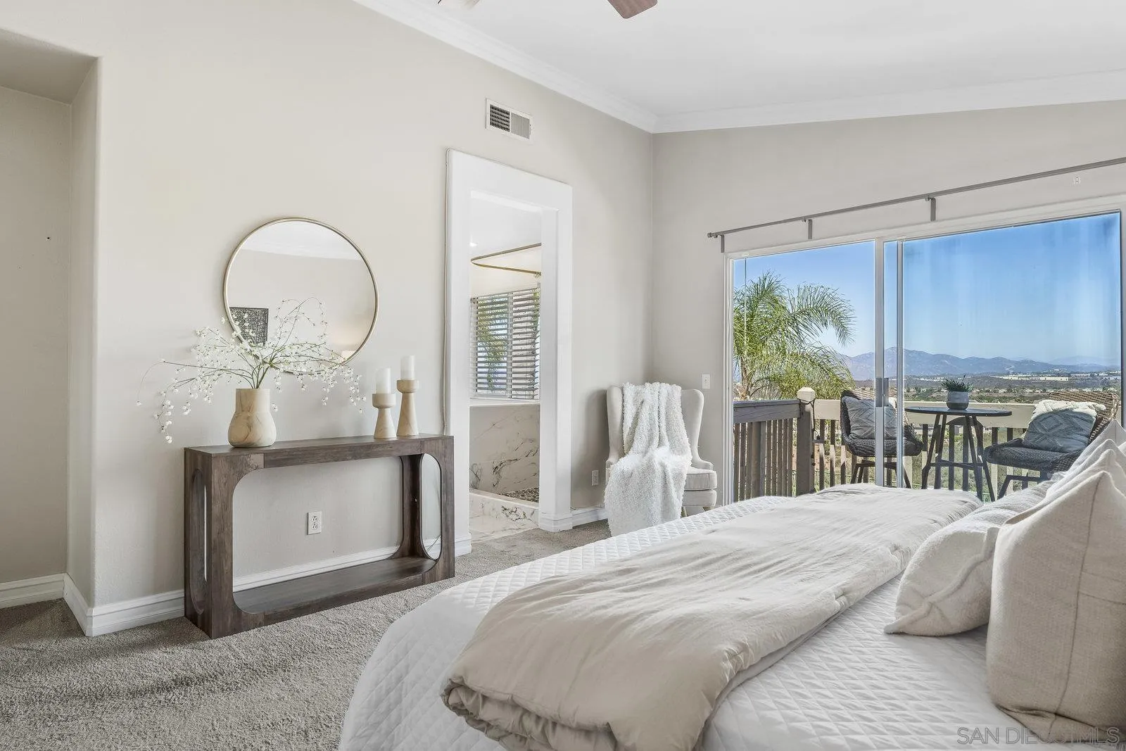 11542 Village Ridge Road San Diego, CA 92131 - Photo 20 of 42 a bedroom with a bed and large windows