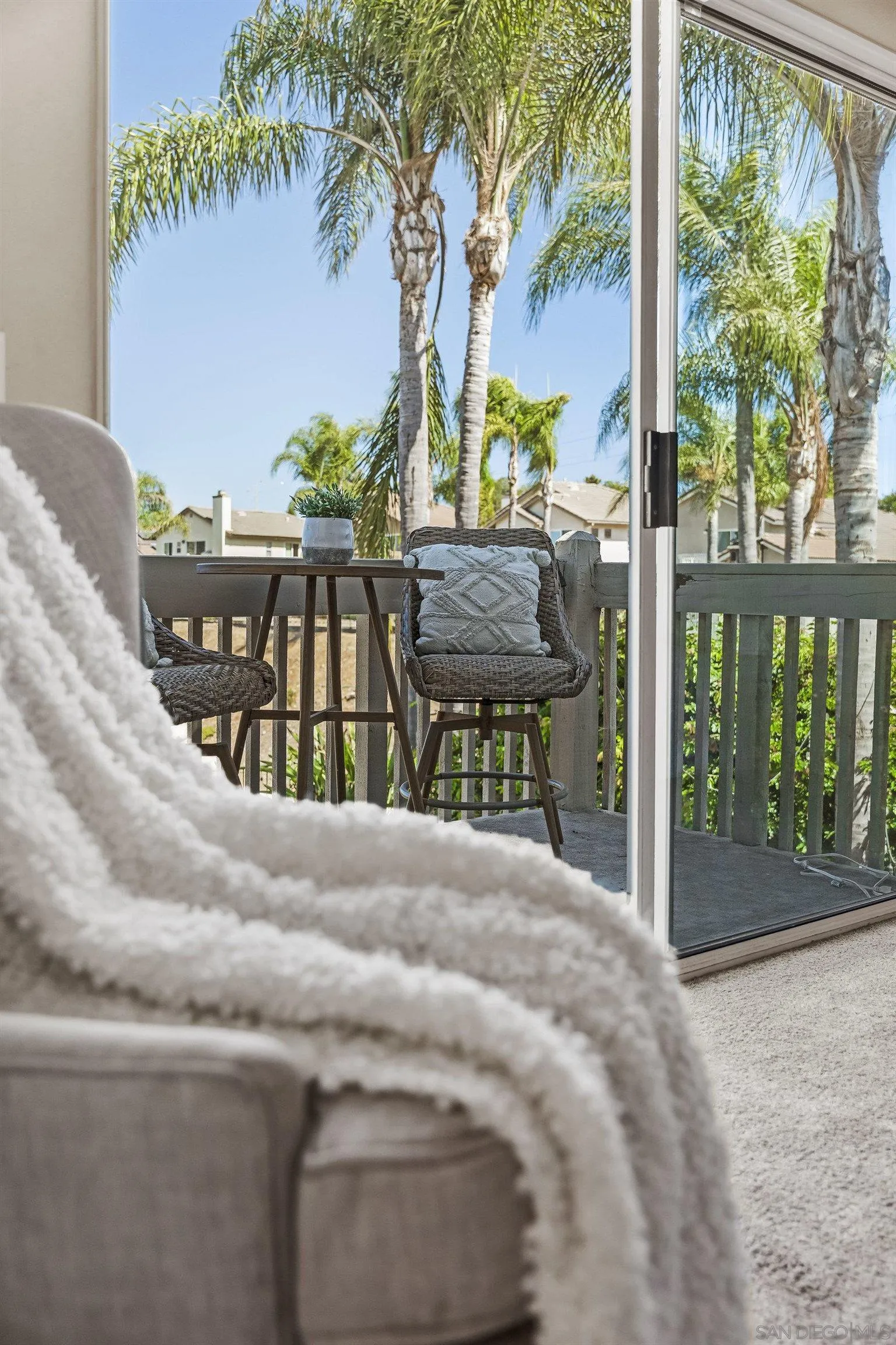 11542 Village Ridge Road San Diego, CA 92131 - Photo 21 of 42 a bedroom with furniture and large windows
