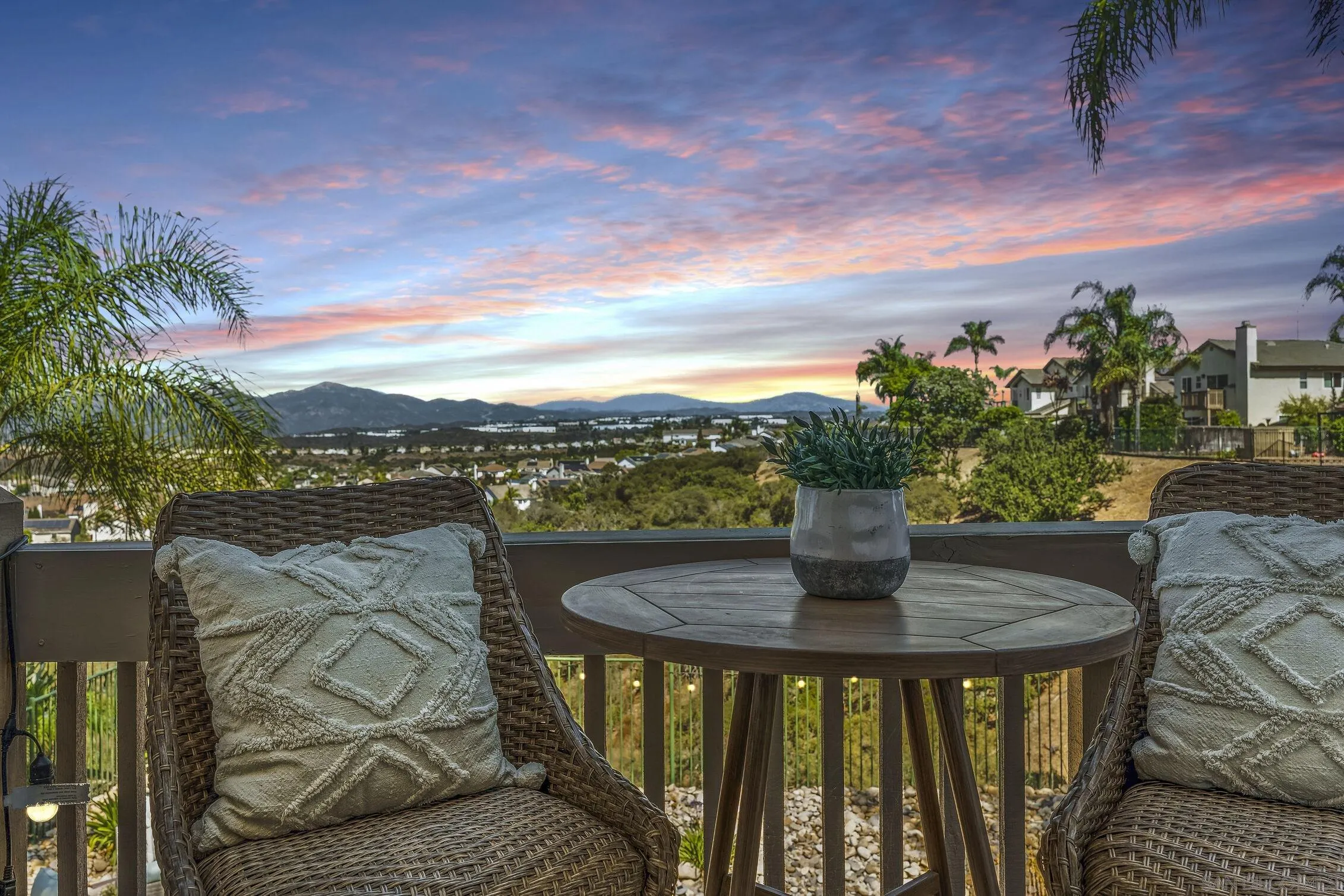 11542 Village Ridge Road San Diego, CA 92131 - Photo 23 of 42 a balcony with table and chairs