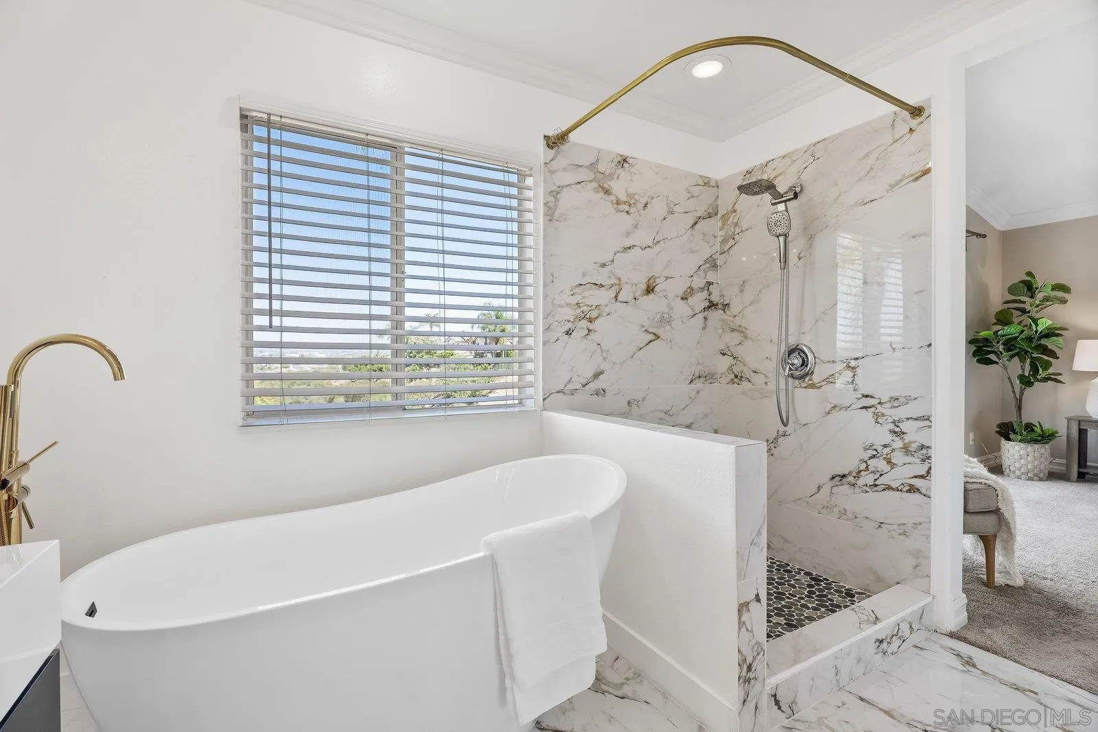 11542 Village Ridge Road San Diego, CA 92131 - Photo 24 of 42 a bathroom with a bathtub and shower