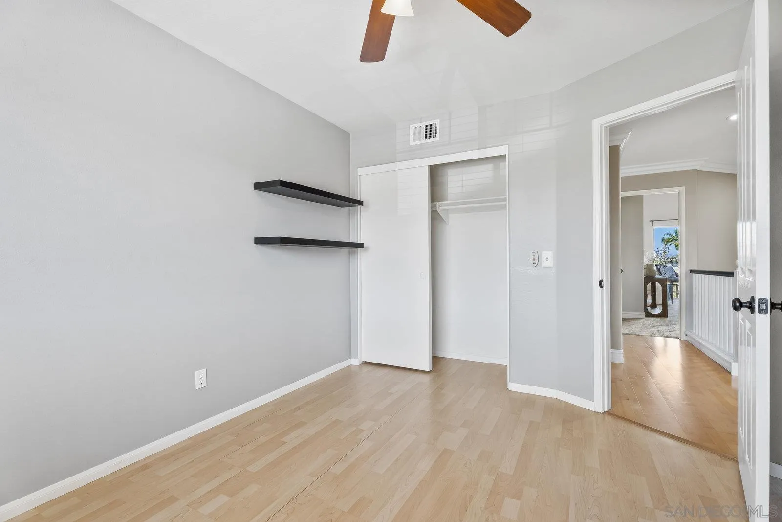 11542 Village Ridge Road San Diego, CA 92131 - Photo 29 of 42 wooden floor in an empty room