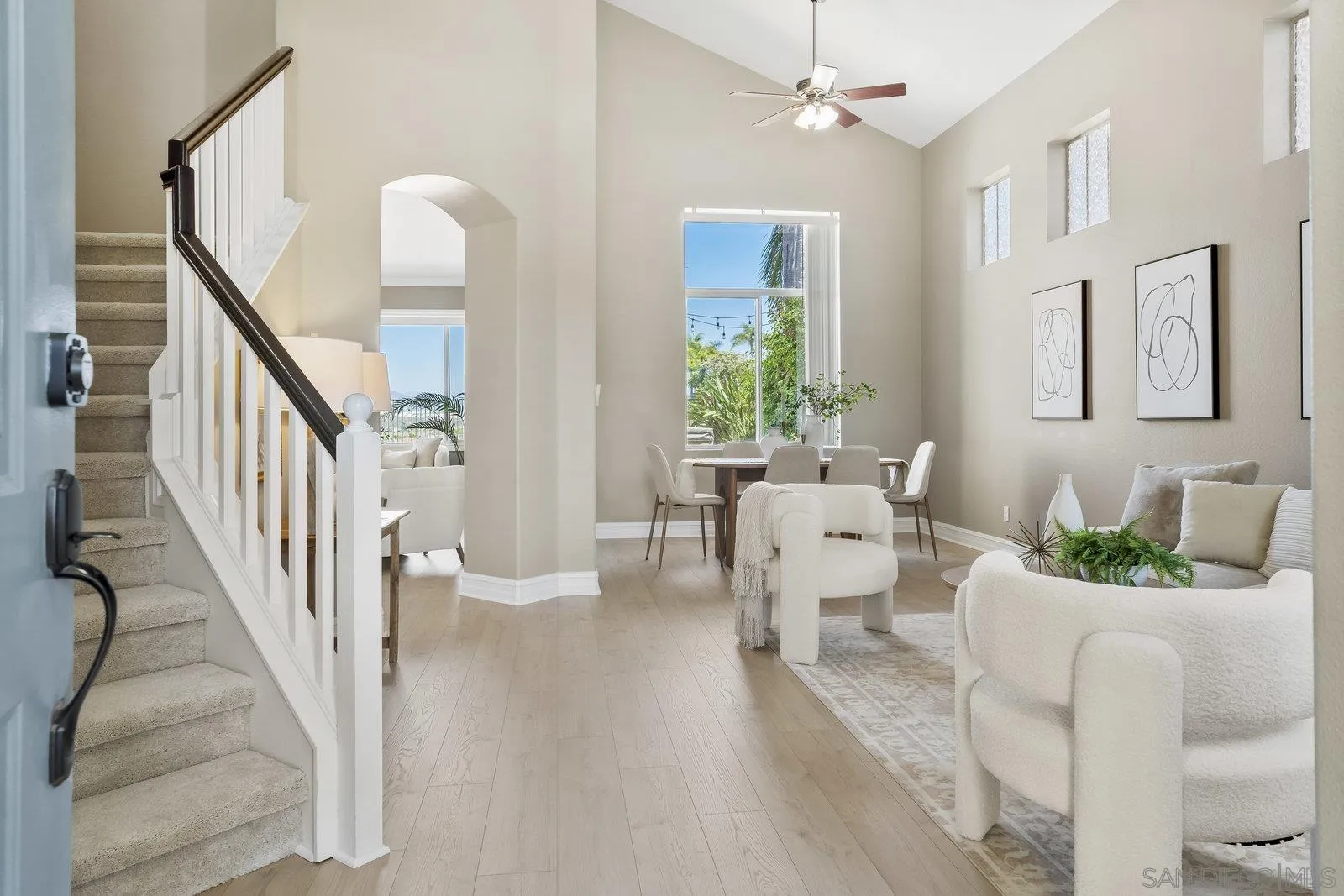 11542 Village Ridge Road San Diego, CA 92131 - Photo 3 of 42 a living room with furniture and a chandelier