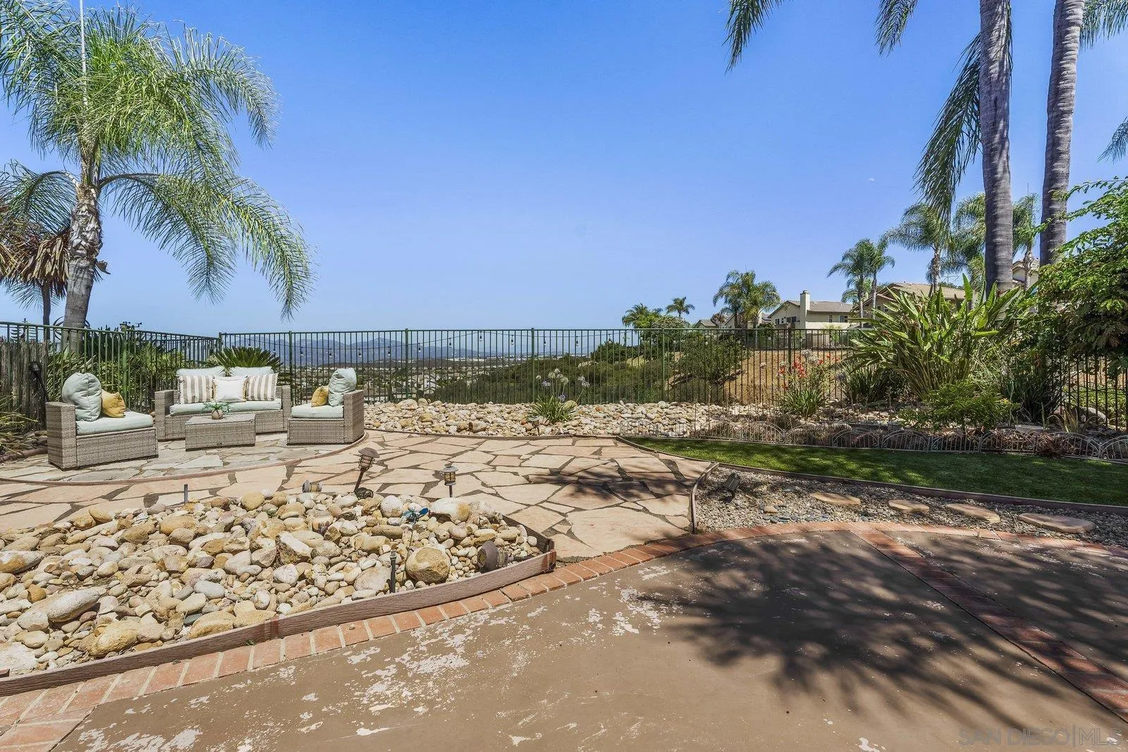 11542 Village Ridge Road San Diego, CA 92131 - Photo 32 of 42 a view of a road with a yard