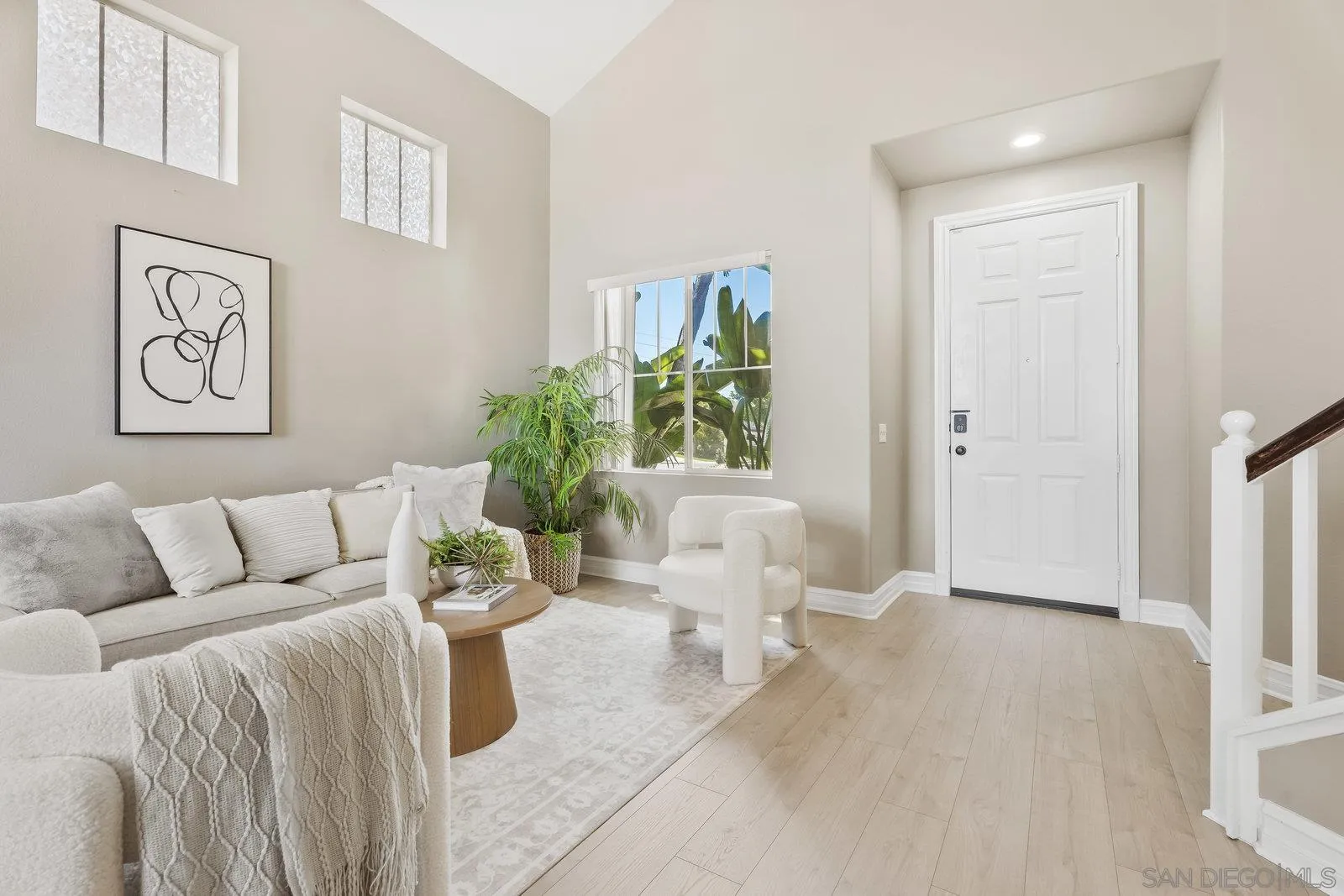 11542 Village Ridge Road San Diego, CA 92131 - Photo 4 of 42 a living room with furniture and wooden floor