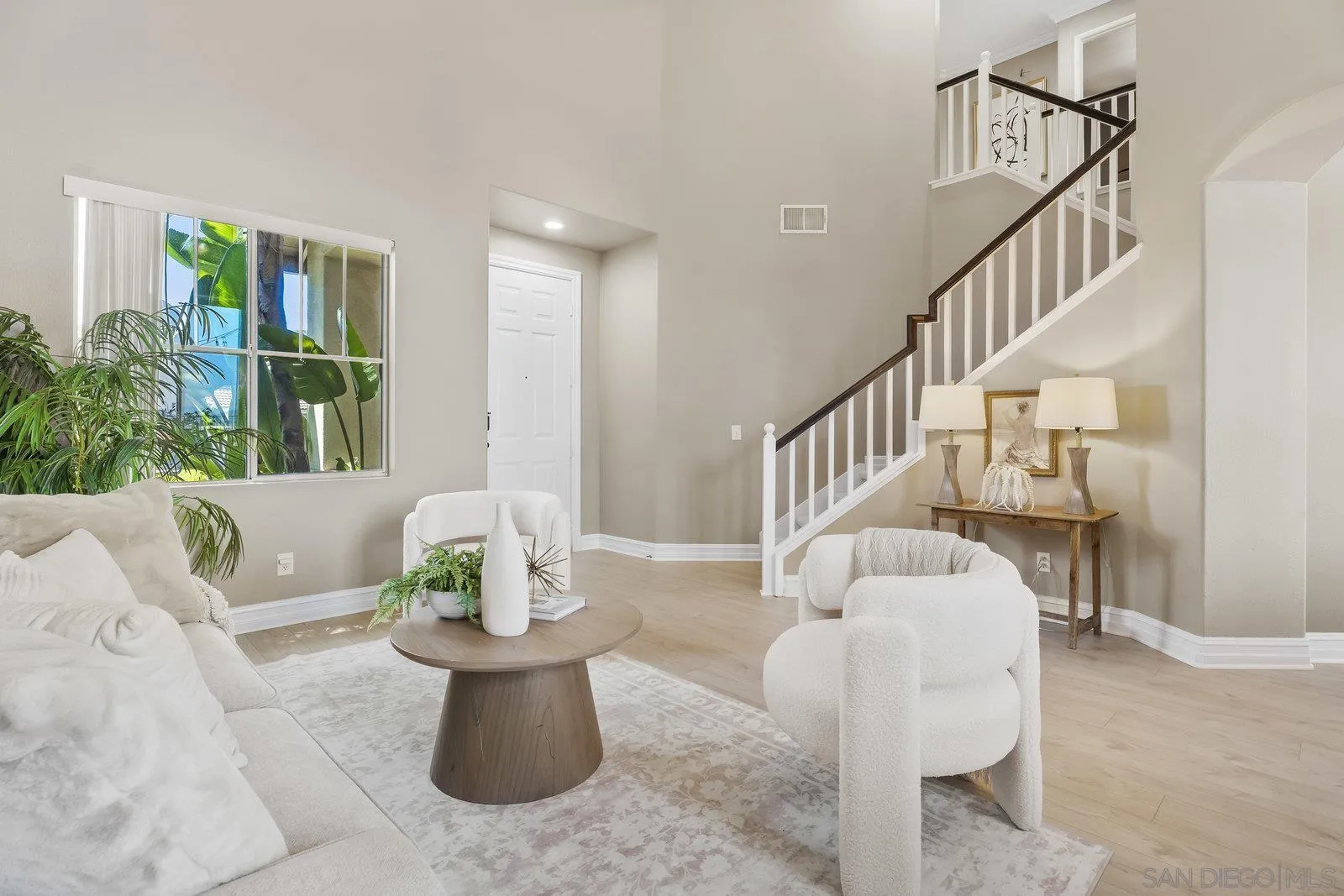 11542 Village Ridge Road San Diego, CA 92131 - Photo 5 of 42 a living room with furniture and a potted plant