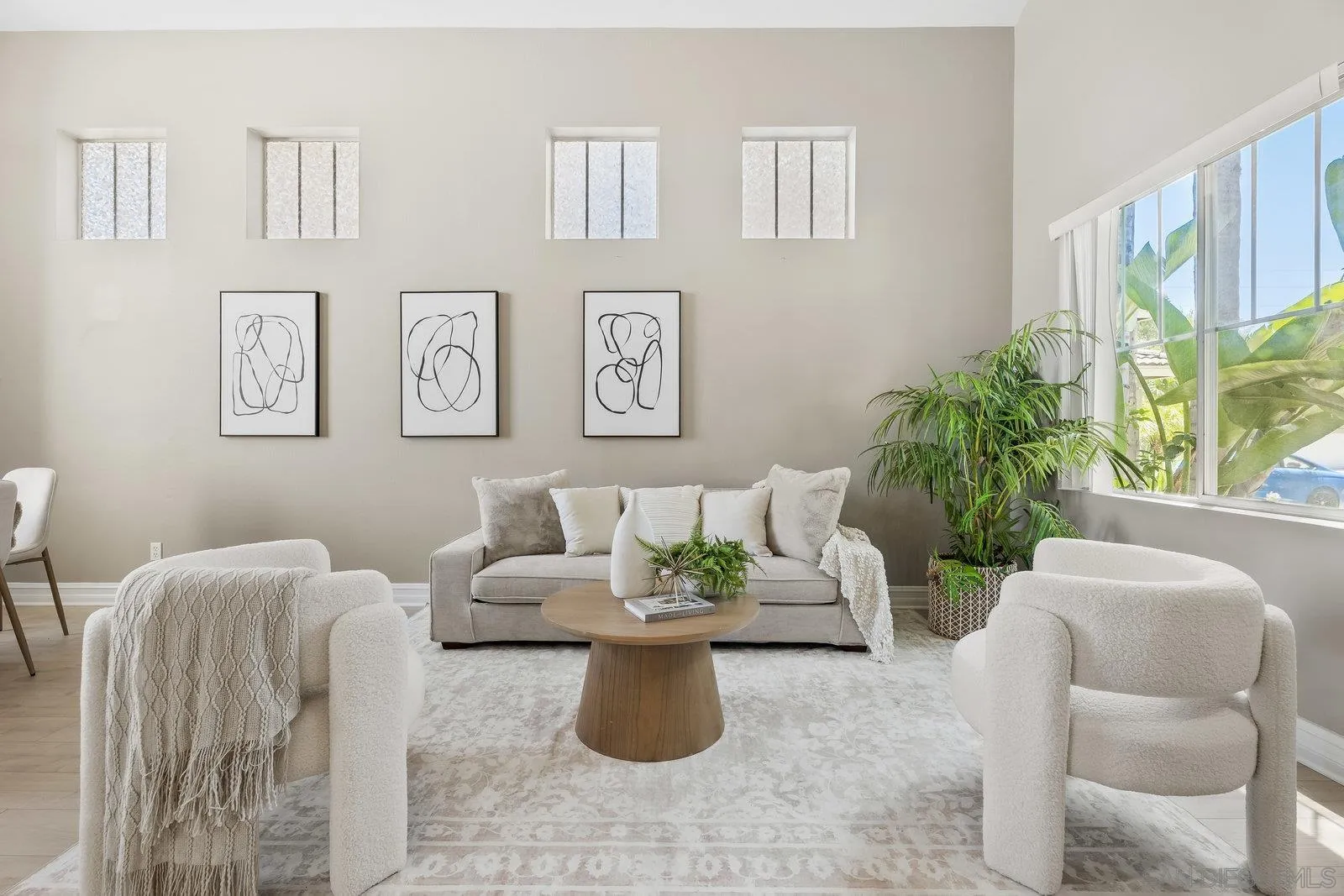 11542 Village Ridge Road San Diego, CA 92131 - Photo 6 of 42 a living room with furniture potted plant and white walls
