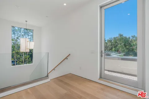 a view of roof and front of a yard