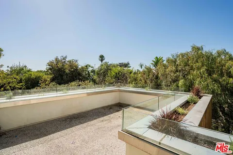 a view of living area with furniture and city view