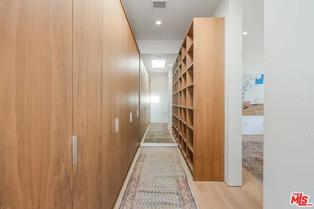 a bathroom with a granite countertop bathtub sink vanity and mirror