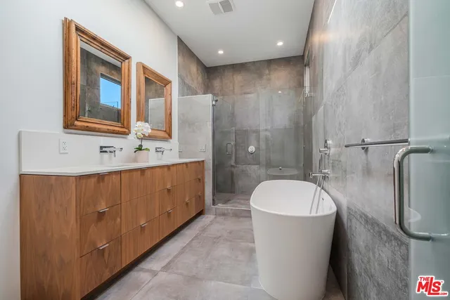 a bed room with a bed and a chair