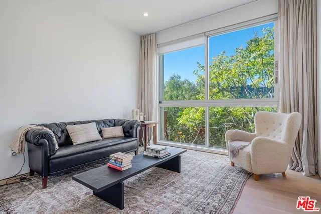 a bathroom with a sink a toilet a mirror and shower