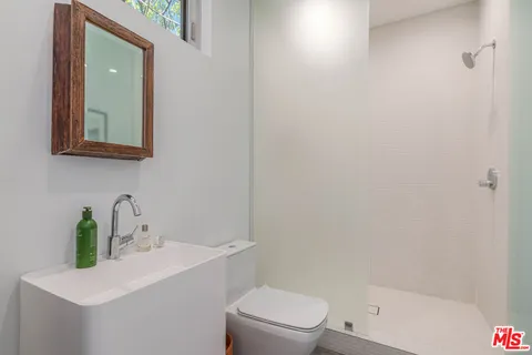a bathroom with a sink and mirror
