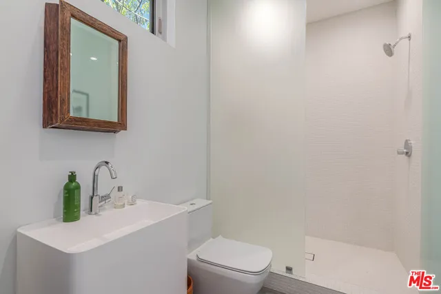 a bathroom with a sink and mirror