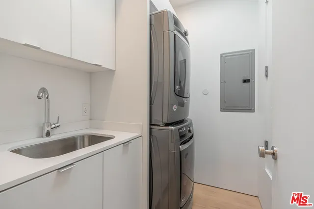 a view of a patio with table and chairs and floor to ceiling window with wooden floor