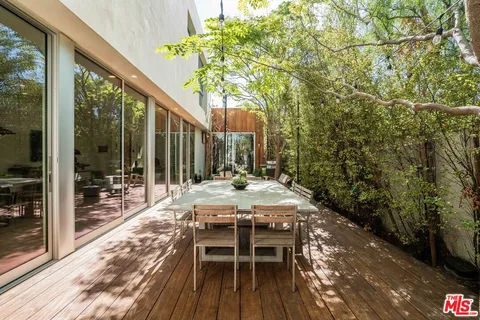 a outdoor space with lots of furniture and a chandelier