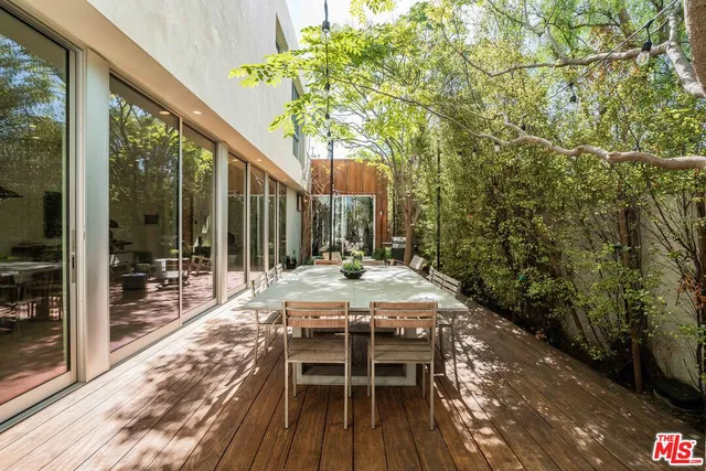 a outdoor space with lots of furniture and a chandelier