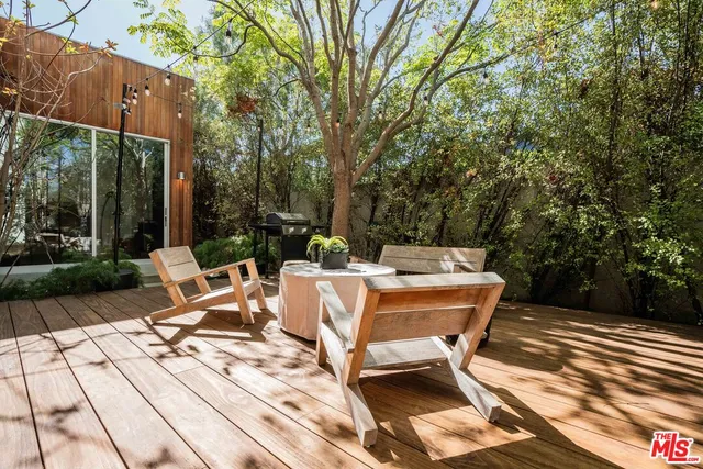 a view of patio with wooden floor