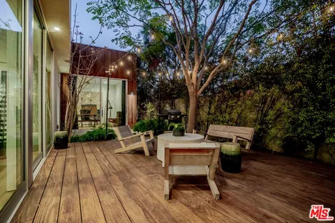 an aerial view of a house with a garden