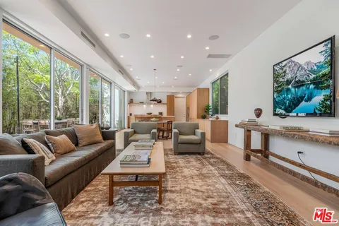 a kitchen with stainless steel appliances a sink and a stove