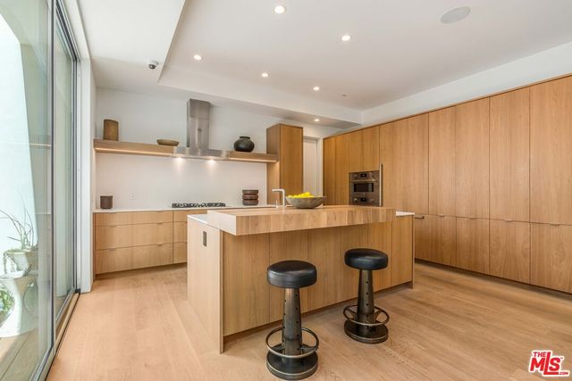 a kitchen with a stove and a sink