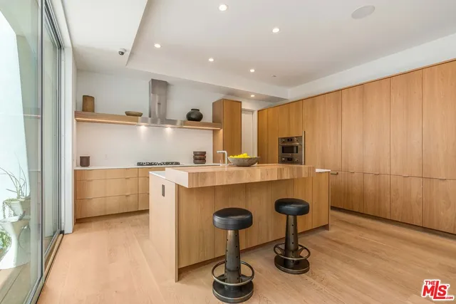 a kitchen with a stove and a sink