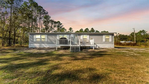a view of a house with a swimming pool