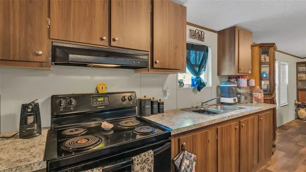 a kitchen with a stove and a microwave