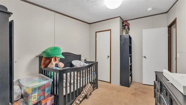 a balcony with furniture and a potted plant