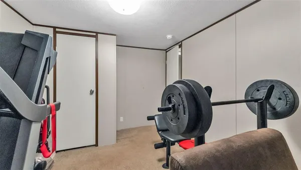 a view of a hallway with washer and dryer