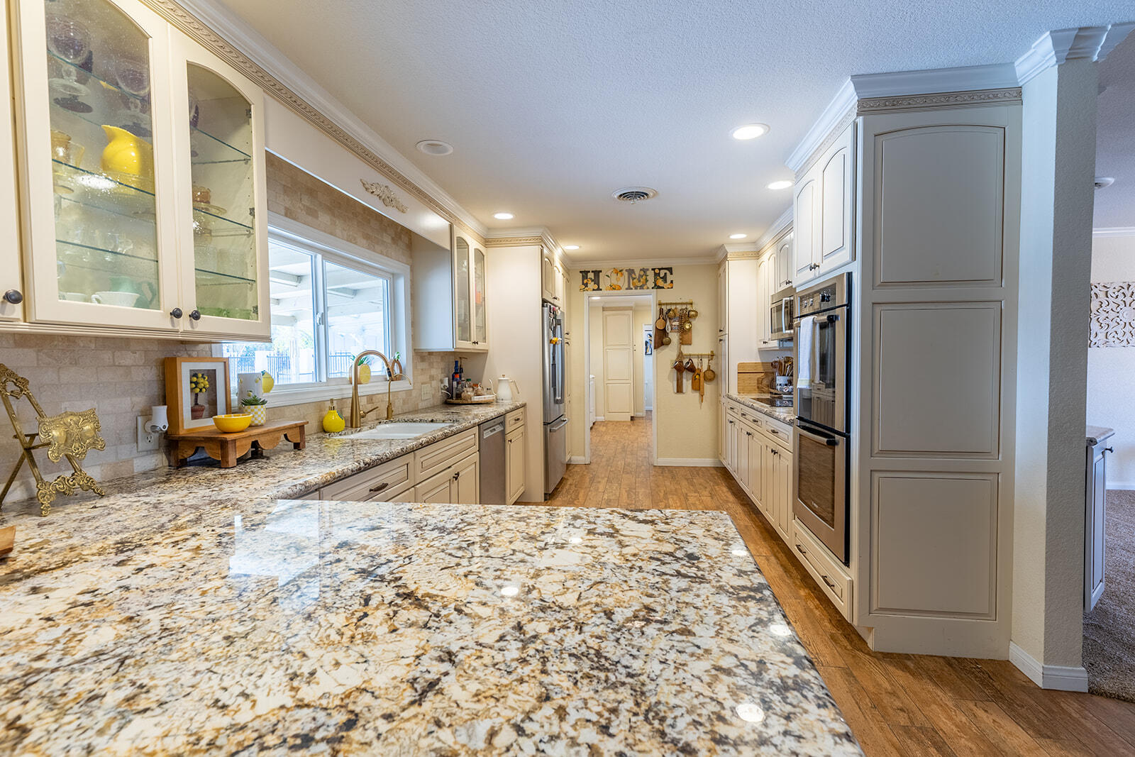 4444 Brandt Road Brawley, CA 92227 - Photo 31 of 93 a view of a kitchen with kitchen island granite countertop a refrigerator and a sink