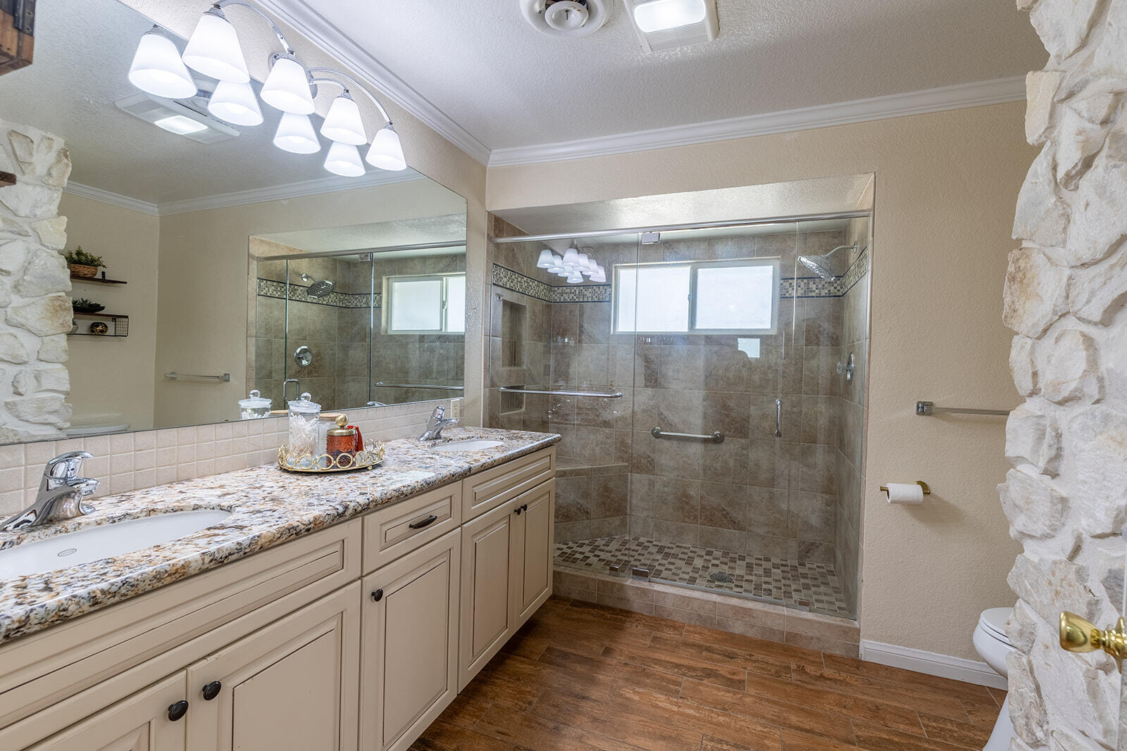 4444 Brandt Road Brawley, CA 92227 - Photo 54 of 93 a bathroom with a granite countertop sink a toilet a mirror and shower