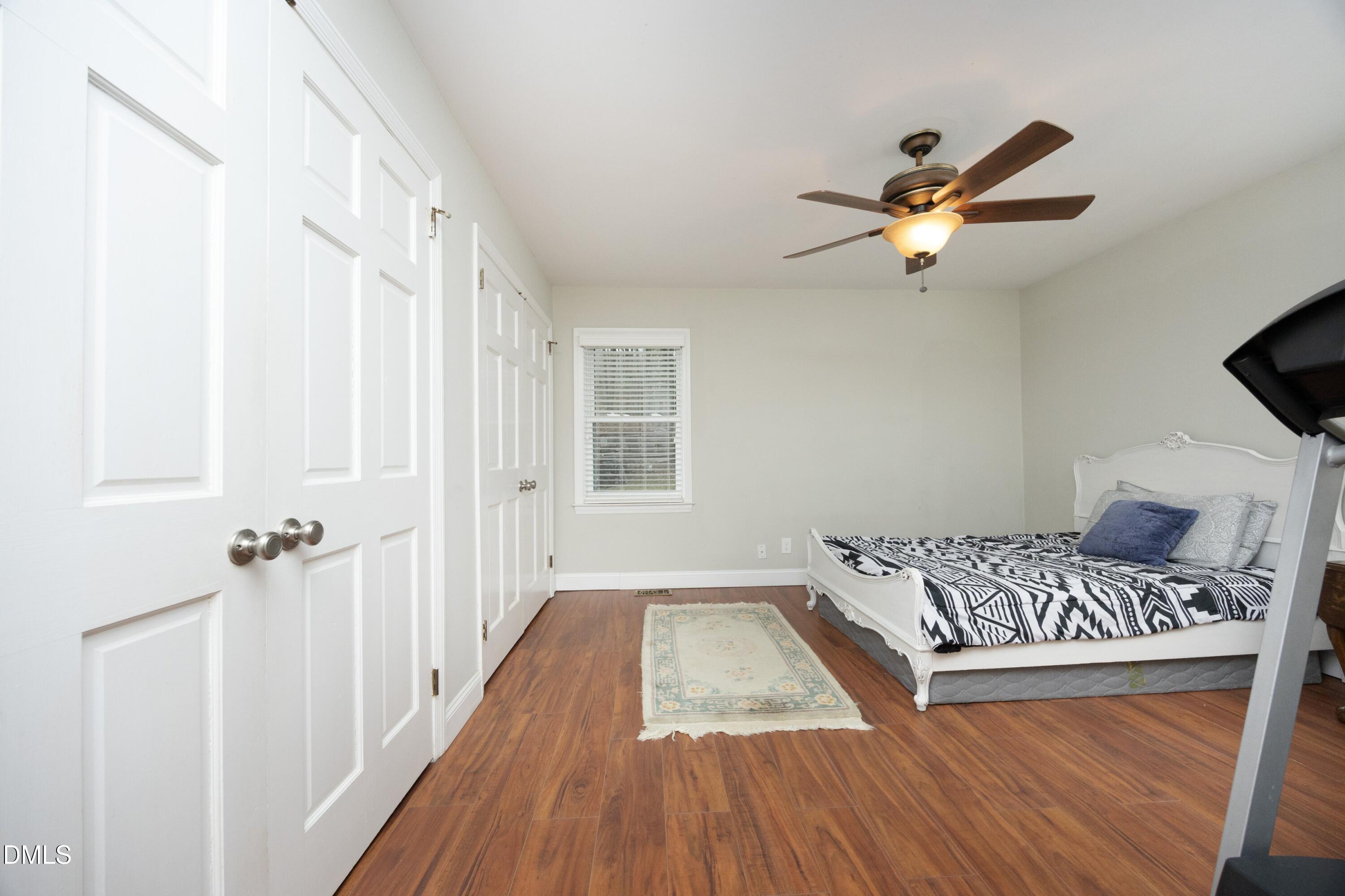 7117 Sunset Lake Road Fuquay-Varina, NC 27526 - Photo 19 of 41 a bedroom with a bed and a window