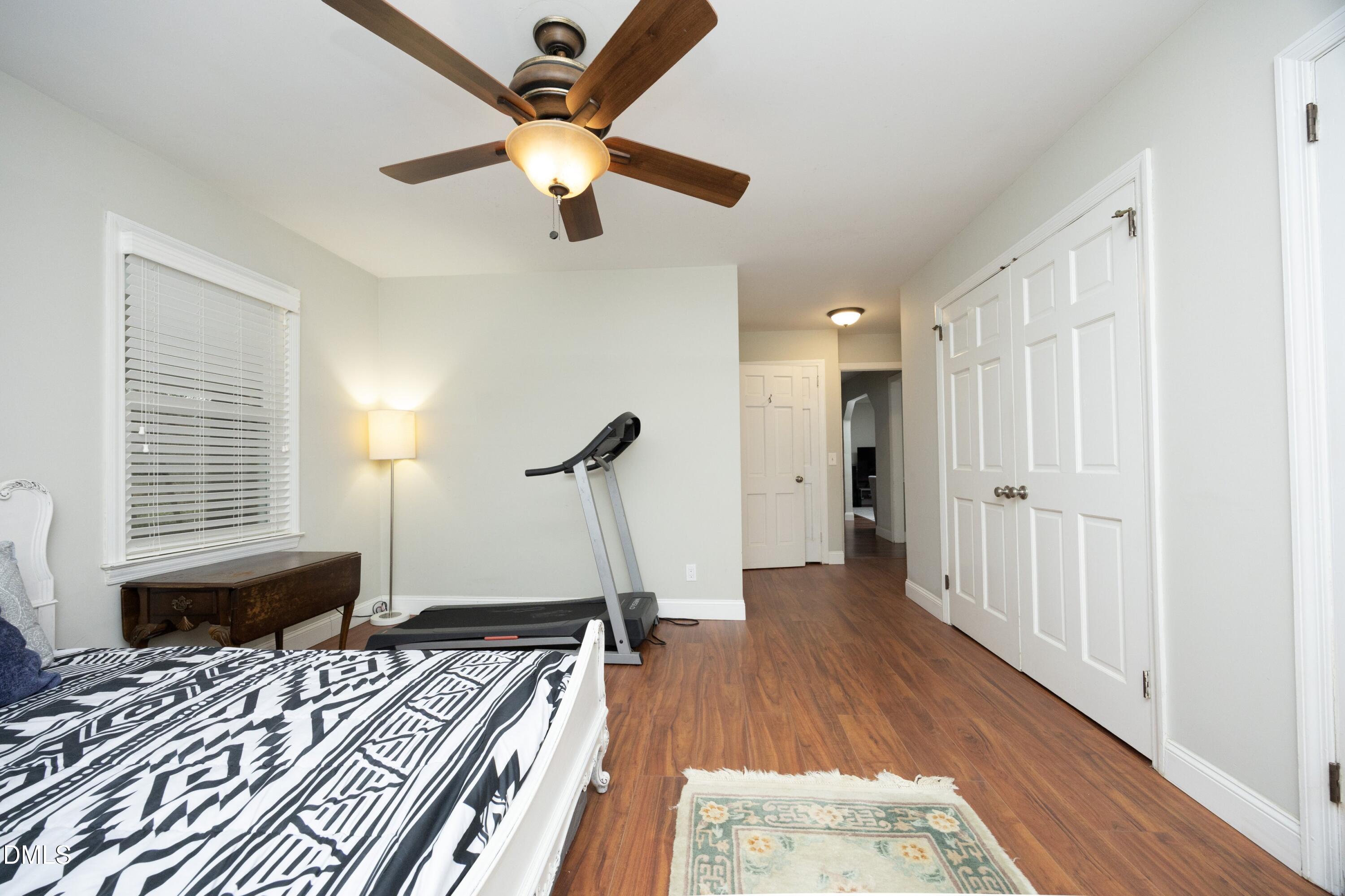 7117 Sunset Lake Road Fuquay-Varina, NC 27526 - Photo 20 of 41 a bedroom with a bed closet and a window