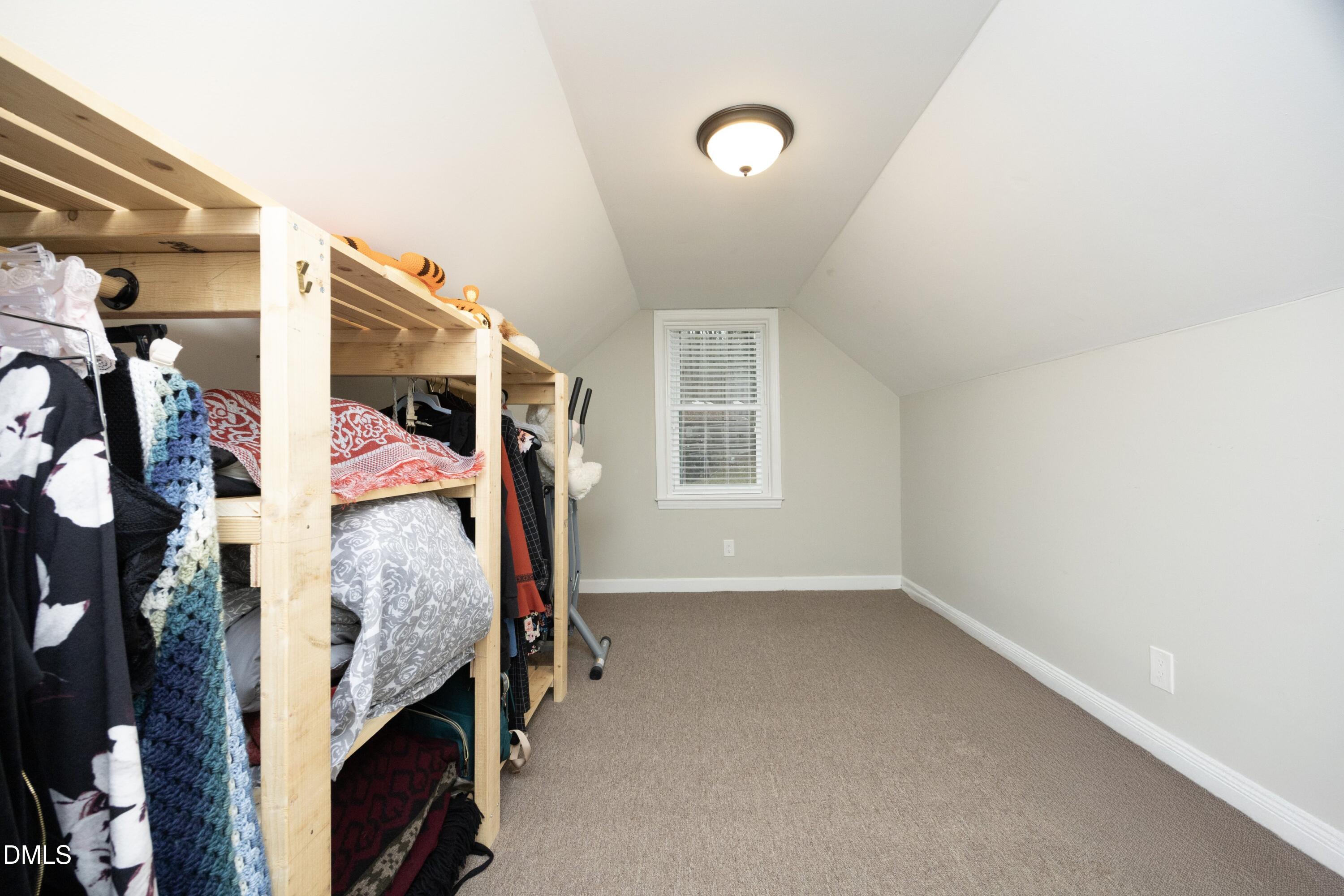 7117 Sunset Lake Road Fuquay-Varina, NC 27526 - Photo 23 of 41 a view of walk in closet with clothes and shoes