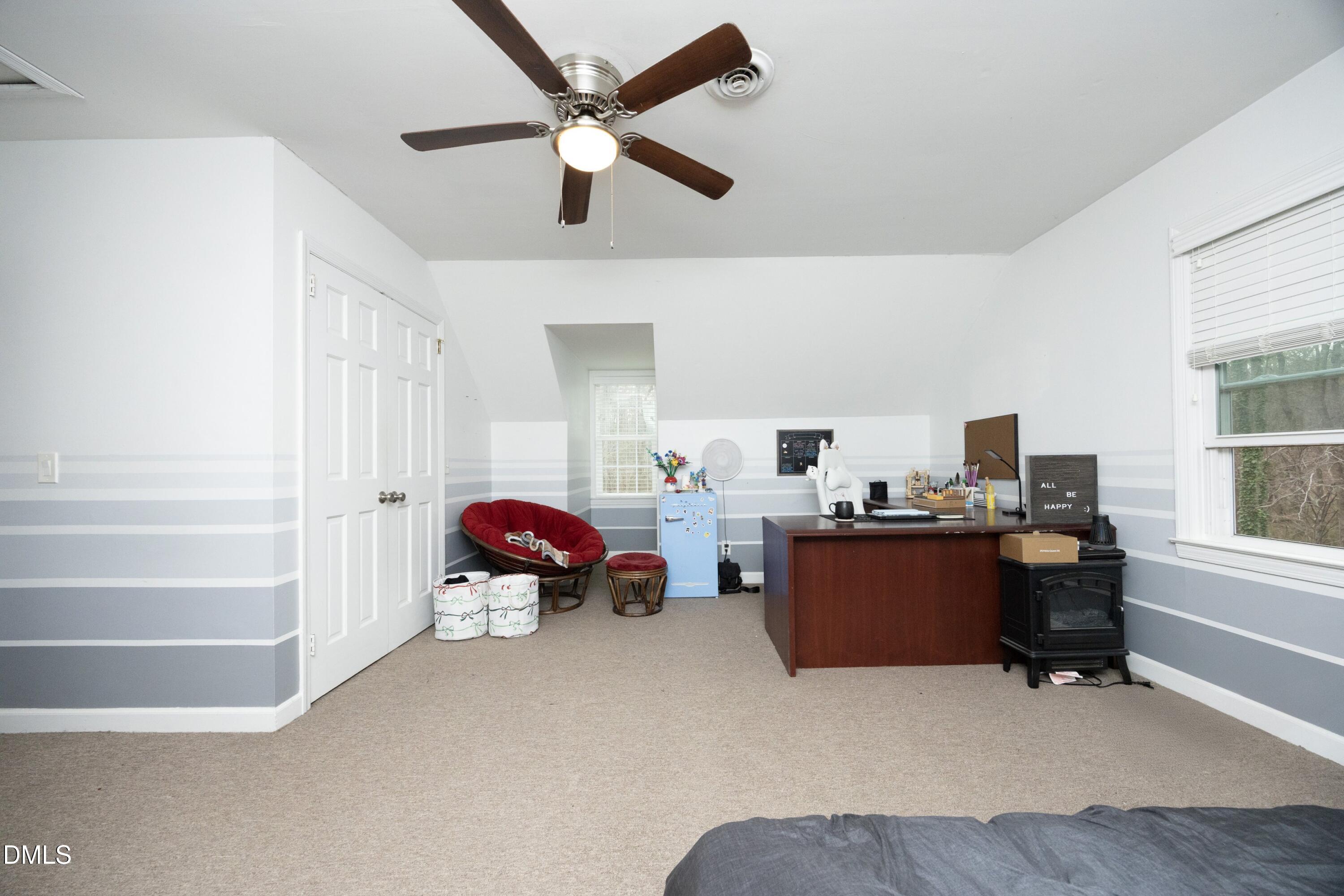 7117 Sunset Lake Road Fuquay-Varina, NC 27526 - Photo 24 of 41 a room with furniture and a window