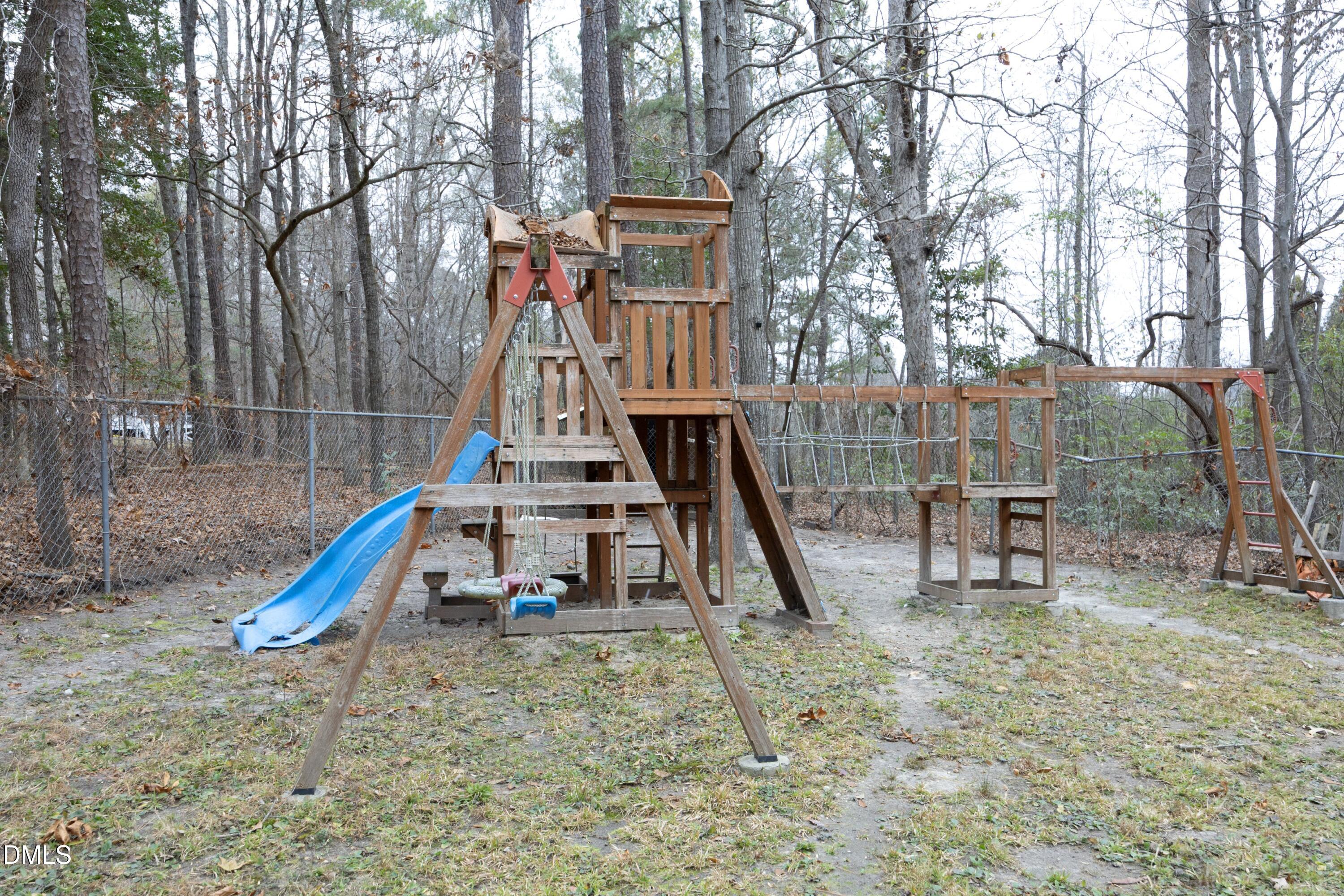 7117 Sunset Lake Road Fuquay-Varina, NC 27526 - Photo 35 of 41 a view of a park with a slide