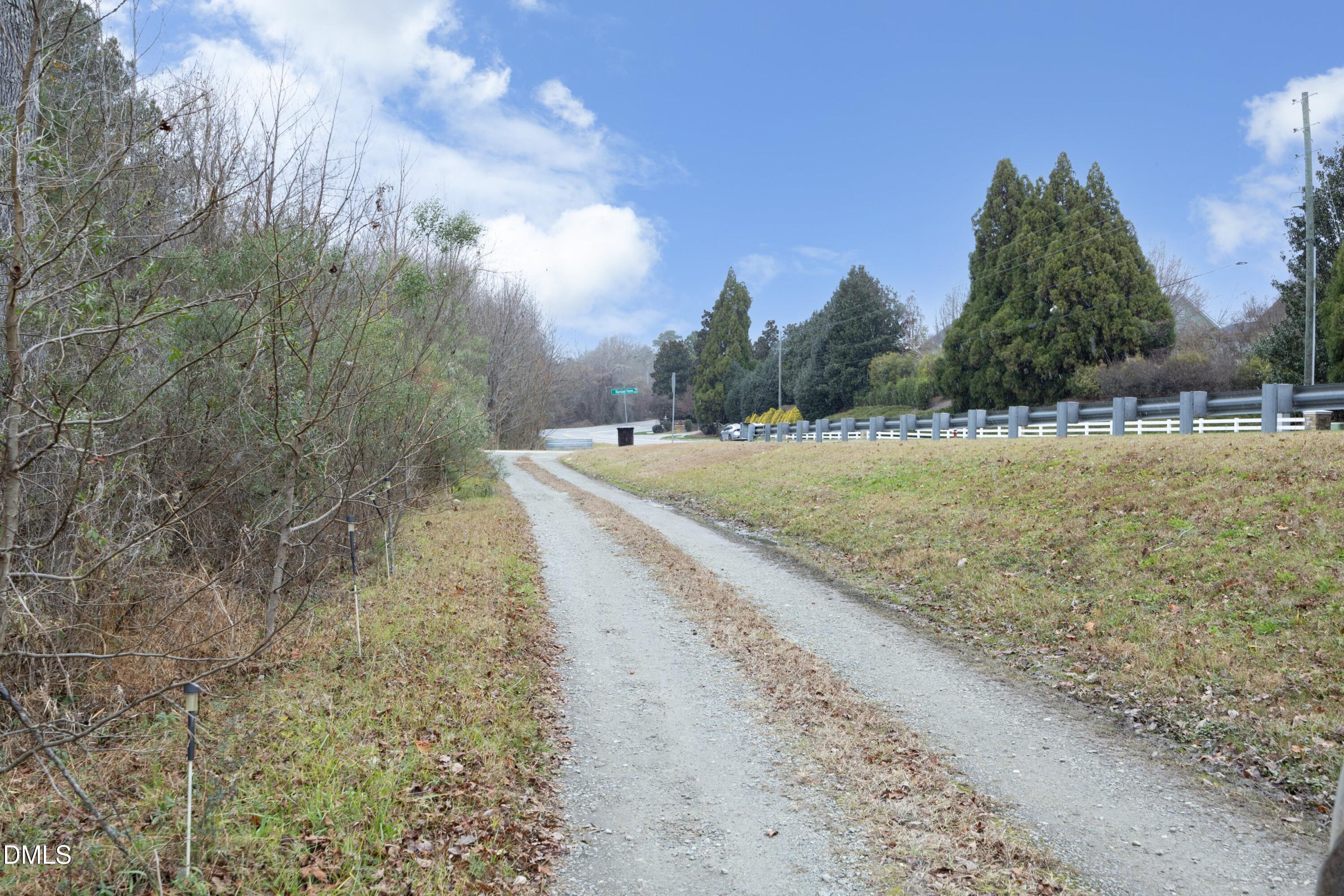 7117 Sunset Lake Road Fuquay-Varina, NC 27526 - Photo 6 of 41 a view of a dry yard with trees