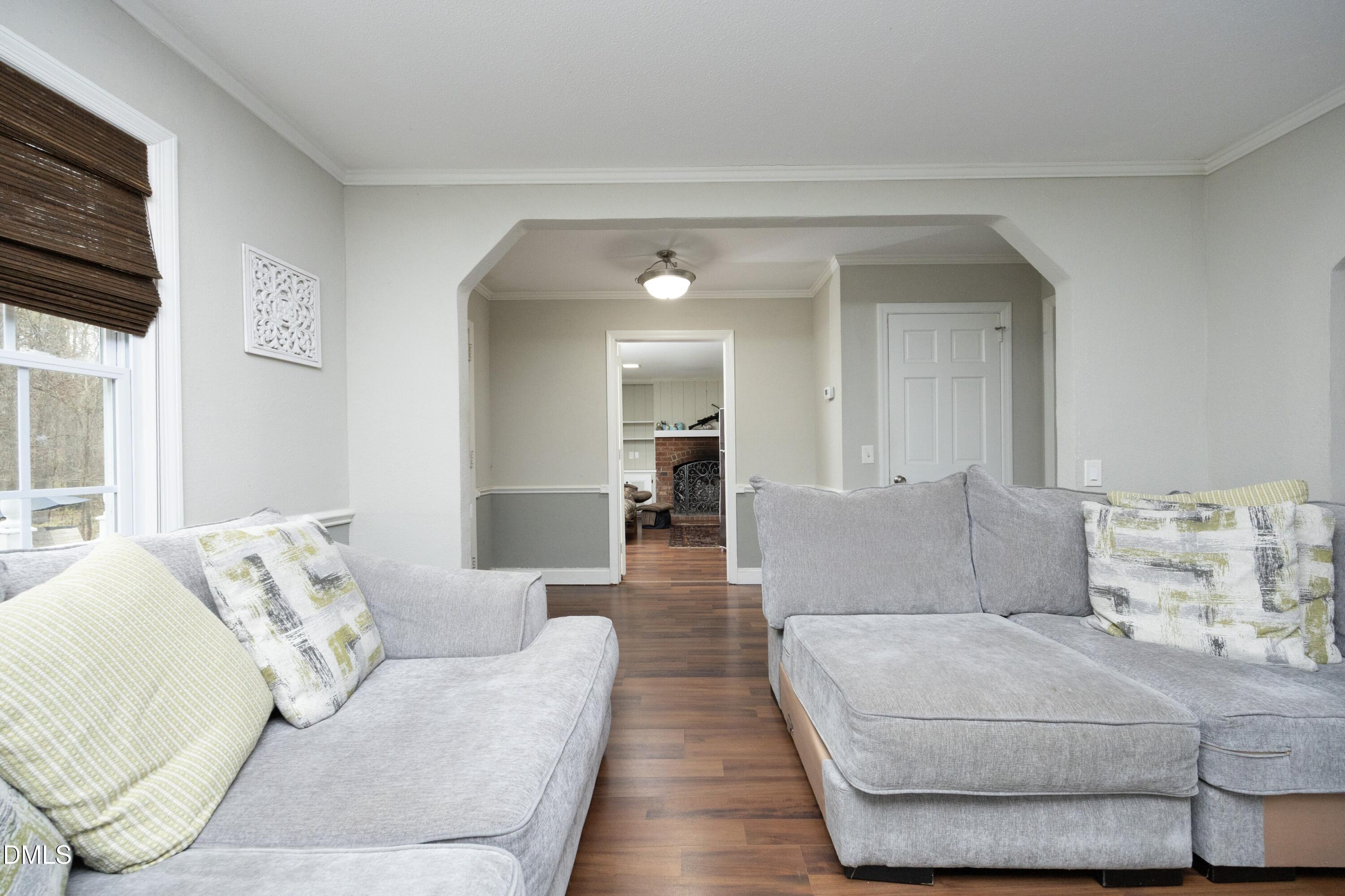 7117 Sunset Lake Road Fuquay-Varina, NC 27526 - Photo 9 of 41 a living room with furniture and a couch