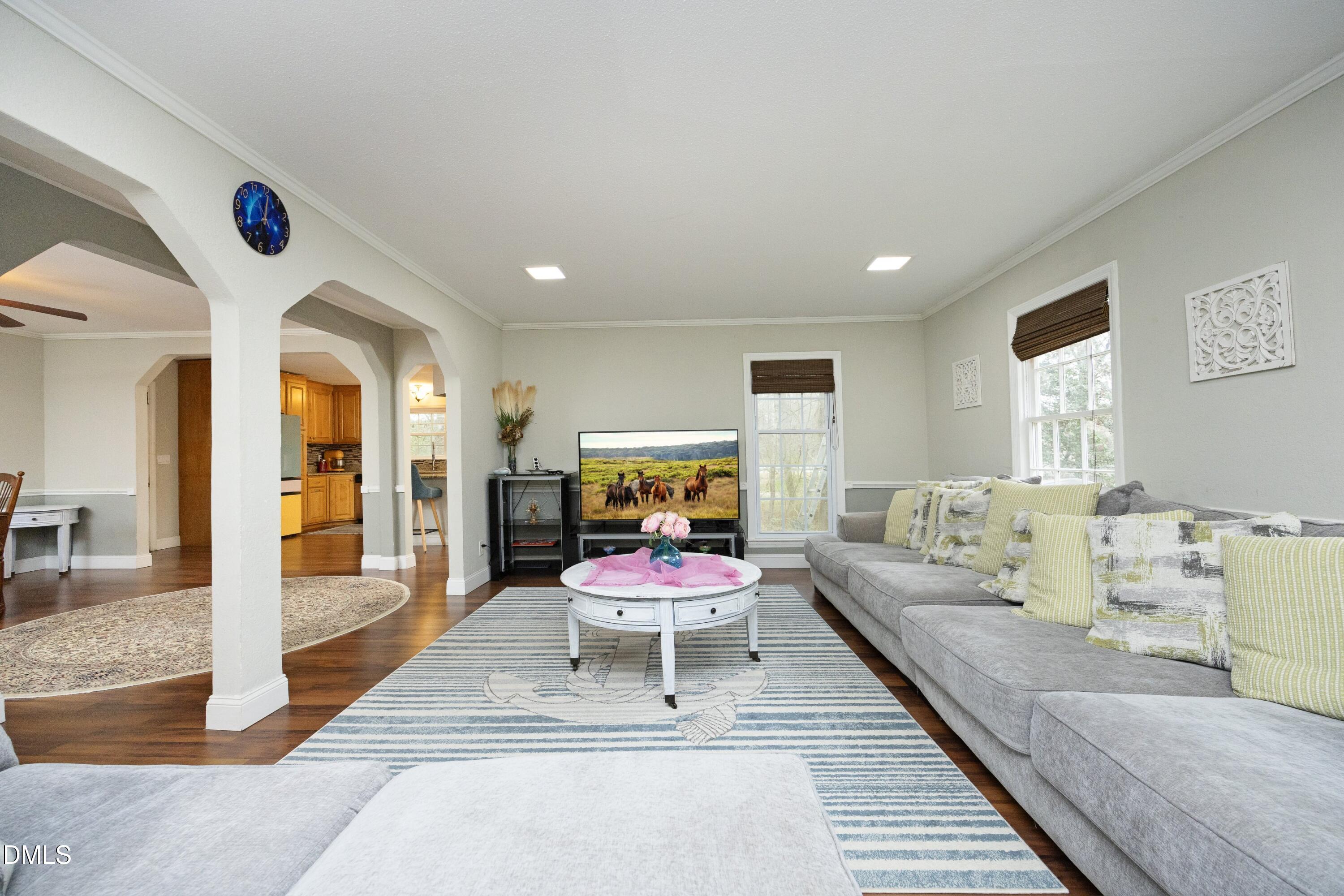 7117 Sunset Lake Road Fuquay-Varina, NC 27526 - Photo 10 of 41 a living room with furniture and wooden floor