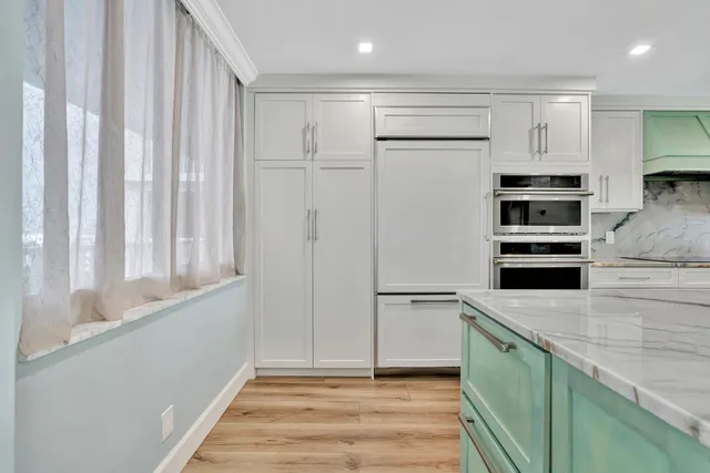 a bathroom with a double vanity sink and mirror