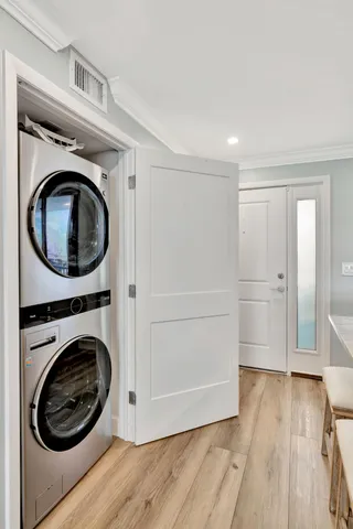 a view of kitchen with refrigerator microwave and wooden floor